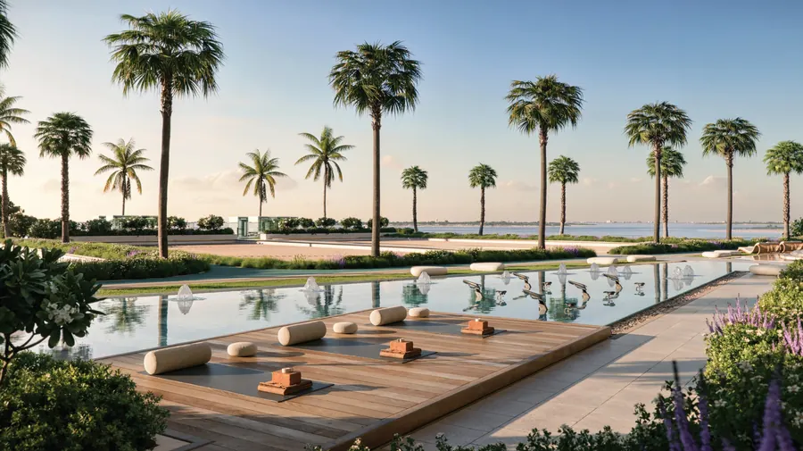 Timber sun deck with daybeds beside a reflecting pool