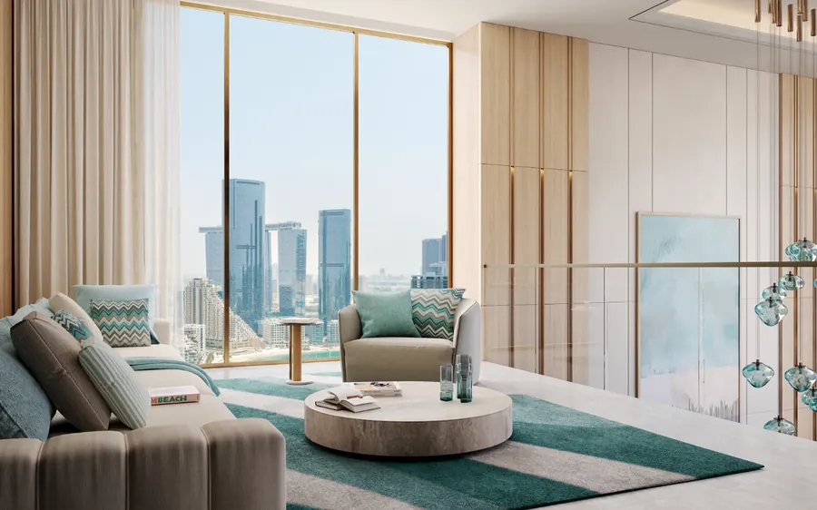 Living area beside a full-height window looking over the Al Reem skyline